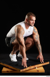 Whole Body Man White Sports Shorts Muscular Kneeling Top Studio photo references